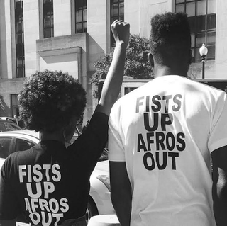 “Fists Up Afros Out” T-shirt
etsy.com